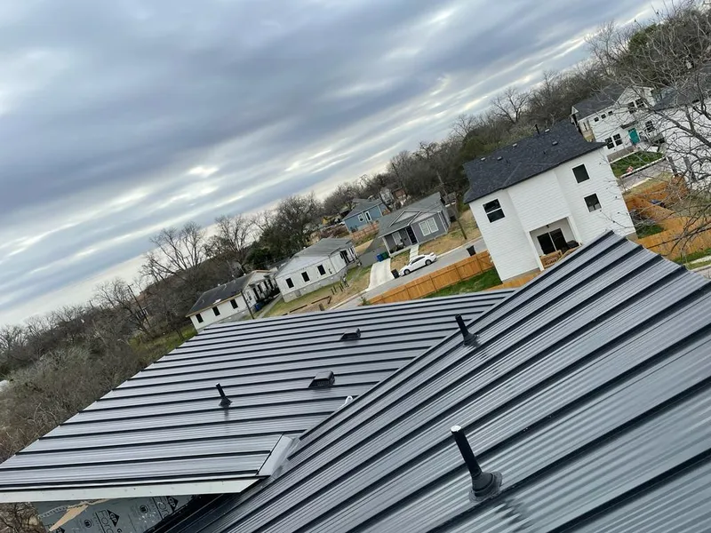 Standing seam metal roof panels with vents for Skylight Repair in Spokane